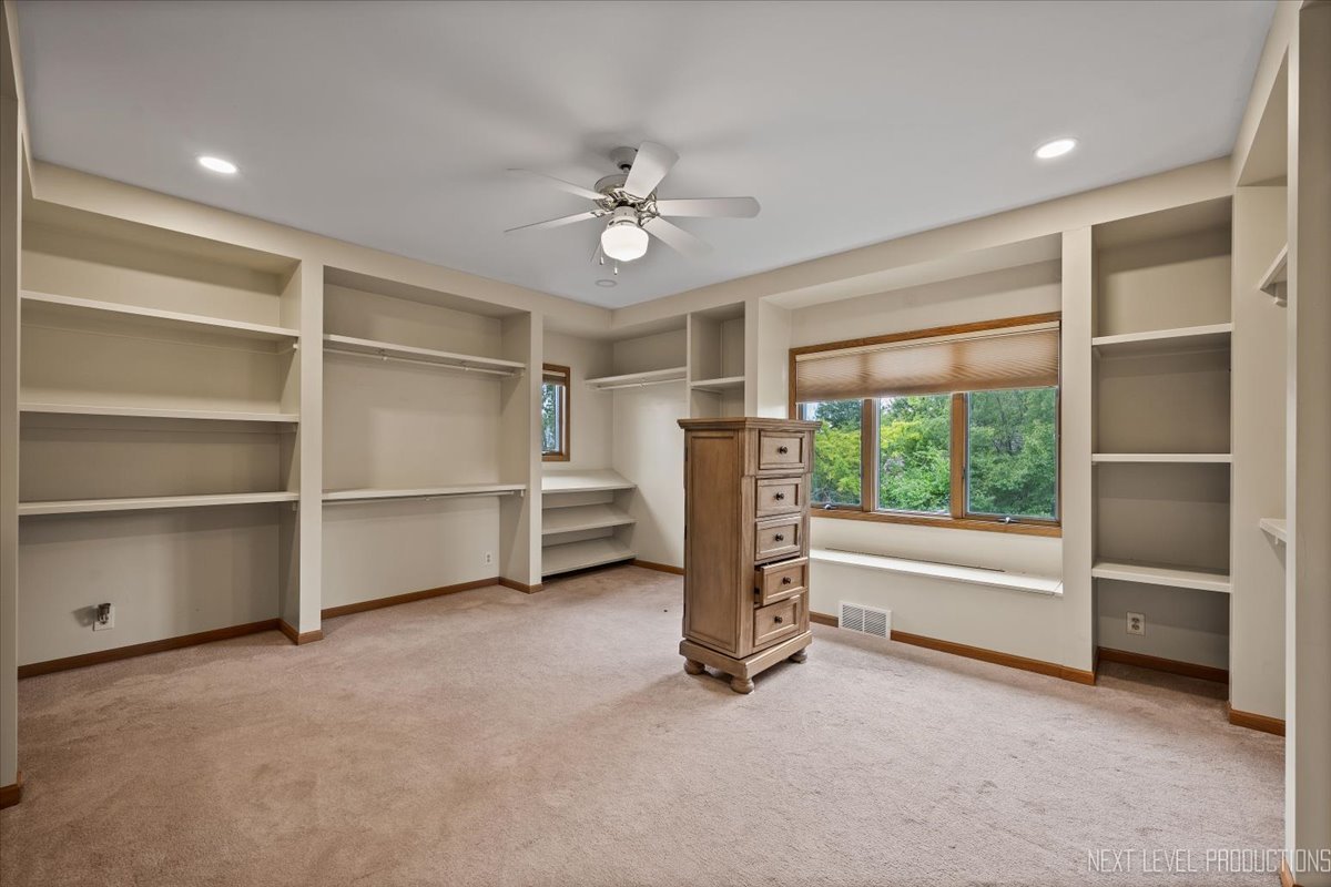 905 Merrill New Road Sugar Grove, IL 60554 - Photo 24 of 44 a view of an empty room with a fireplace and a large window