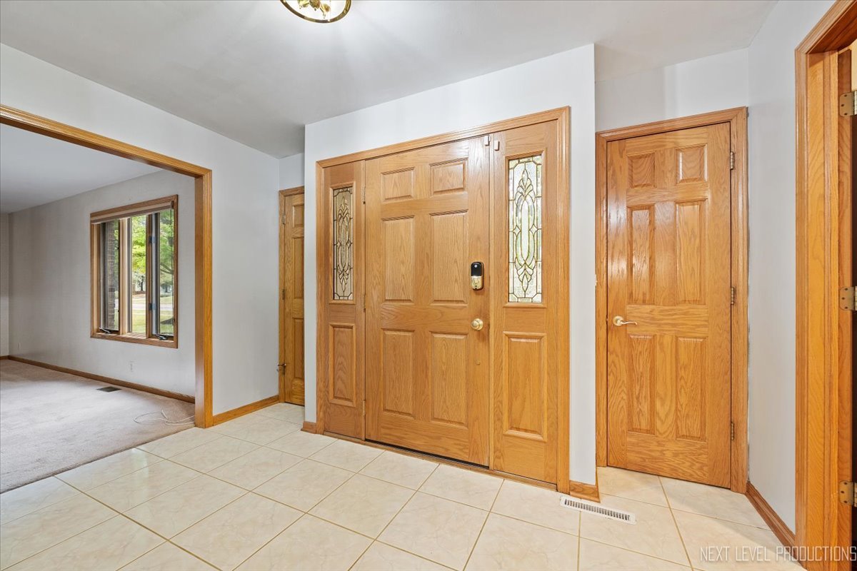 905 Merrill New Road Sugar Grove, IL 60554 - Photo 3 of 44 an empty room with windows and closet