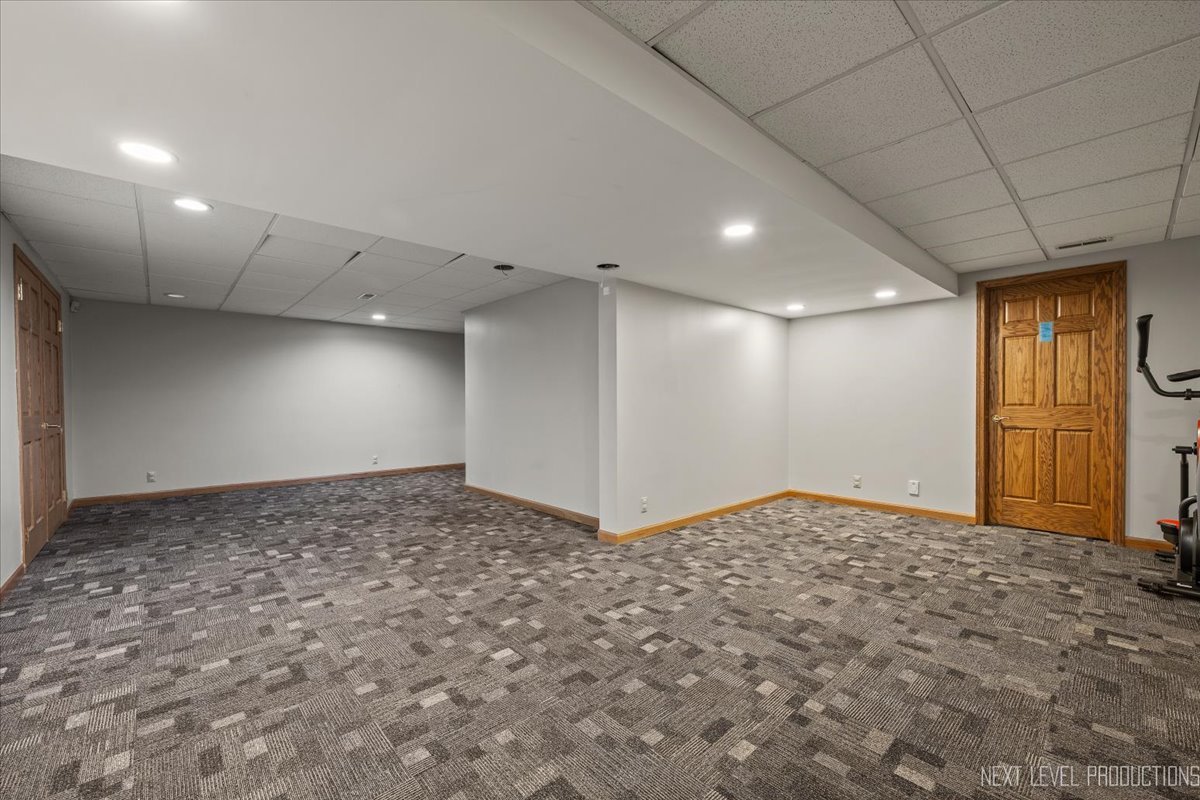 905 Merrill New Road Sugar Grove, IL 60554 - Photo 32 of 44 a view of a livingroom with a staircase