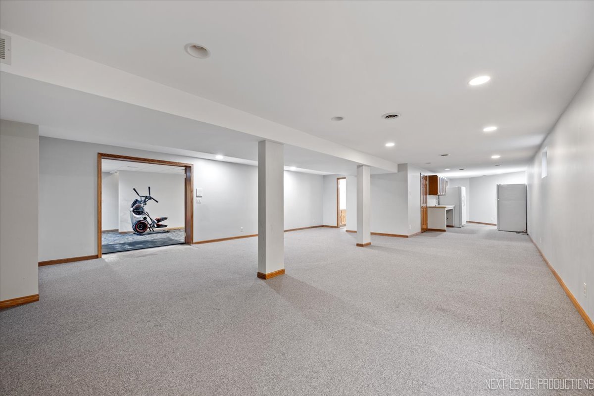 905 Merrill New Road Sugar Grove, IL 60554 - Photo 34 of 44 a view of a livingroom with a staircase