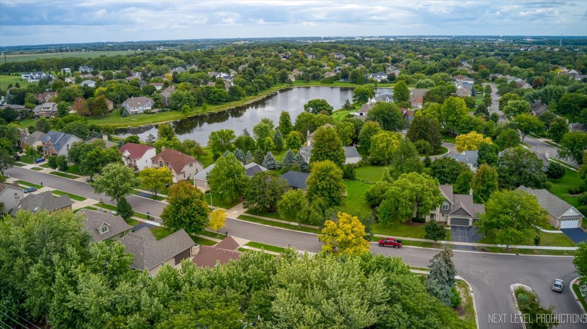905 Merrill New Road Sugar Grove, IL 60554 - Photo 37 of 44 an aerial view of a residential houses with outdoor space and trees