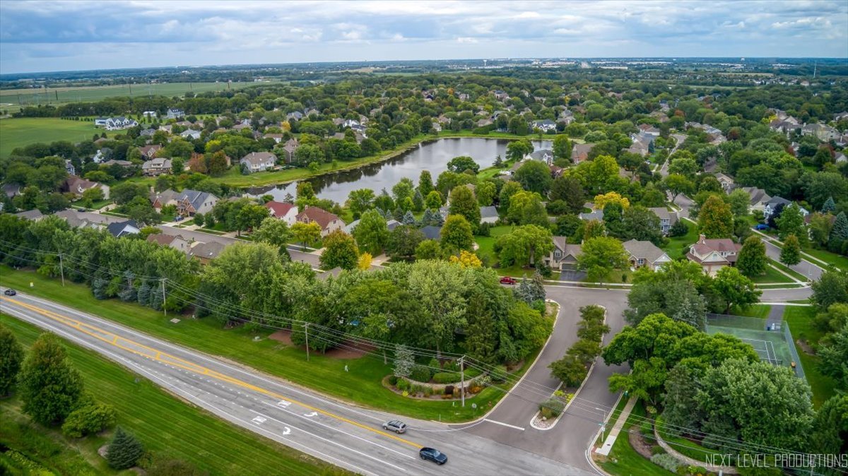 905 Merrill New Road Sugar Grove, IL 60554 - Photo 38 of 44 an aerial view of residential houses with outdoor space and trees