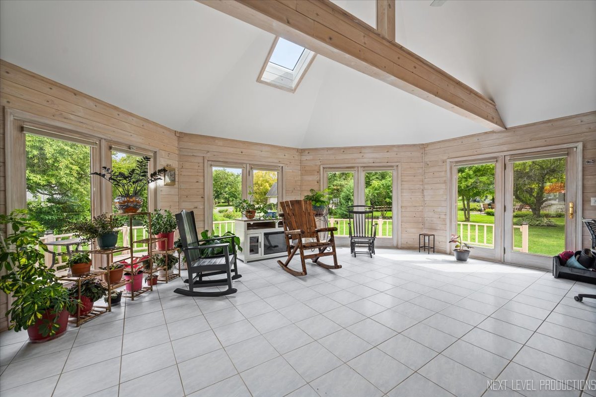 905 Merrill New Road Sugar Grove, IL 60554 - Photo 10 of 44 a living room with furniture and large windows