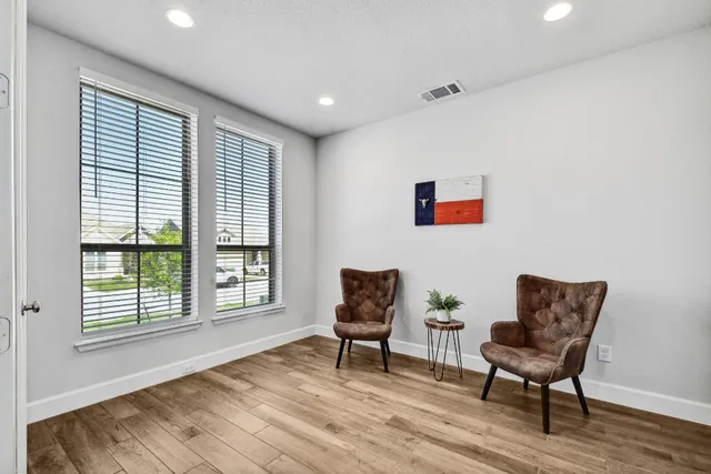 a living room with furniture and a window