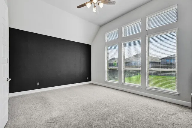 a view of a room with a large window