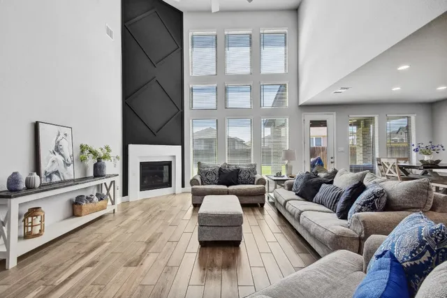 a living room with furniture and a fireplace