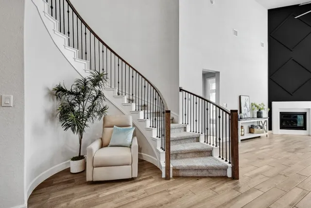 a view of entryway and hall with wooden floor