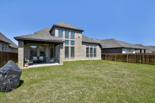a front view of a house with a garden and porch