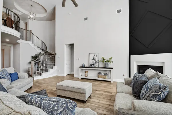 a living room with furniture and a fireplace