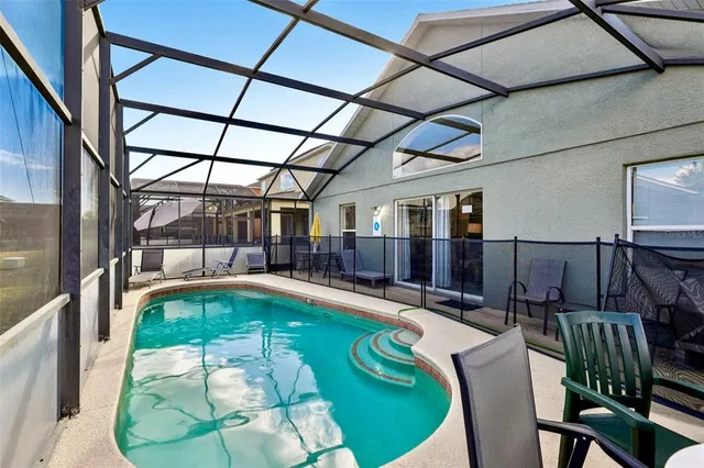 a indoor swimming pool with view of outdoor seating