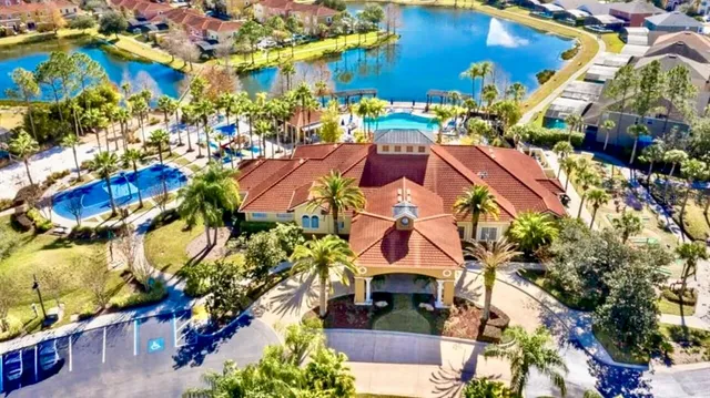 an aerial view of a house with yard