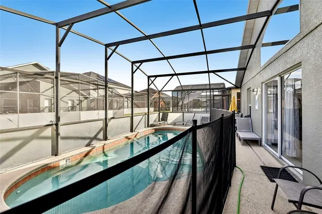 a view of swimming pool with seating area