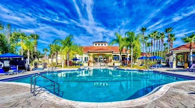 a view of a house with a porch and furniture
