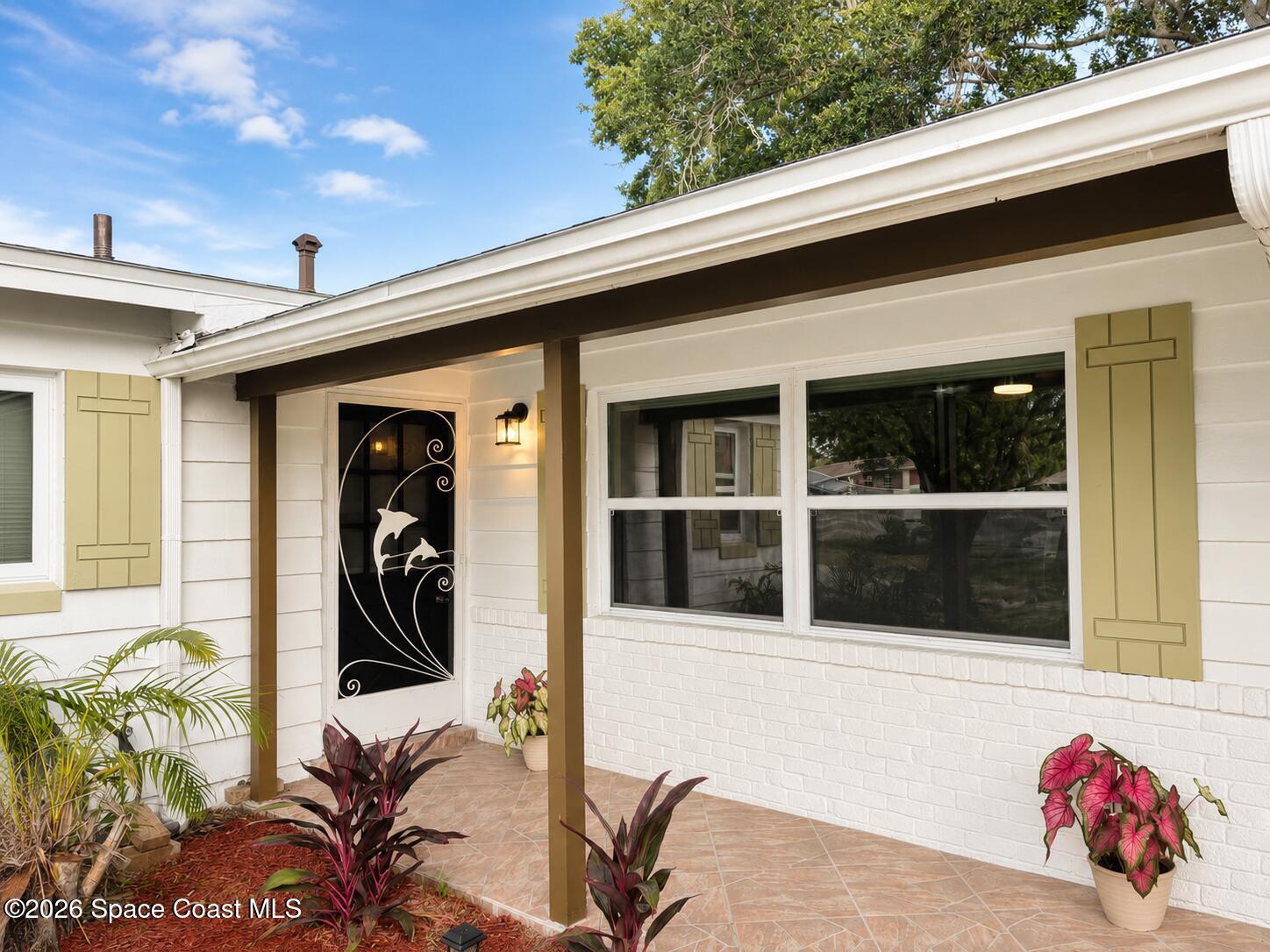 987 Kings Post Road Rockledge, FL 32955 - Photo 18 of 30 a view of a entryway door of the house