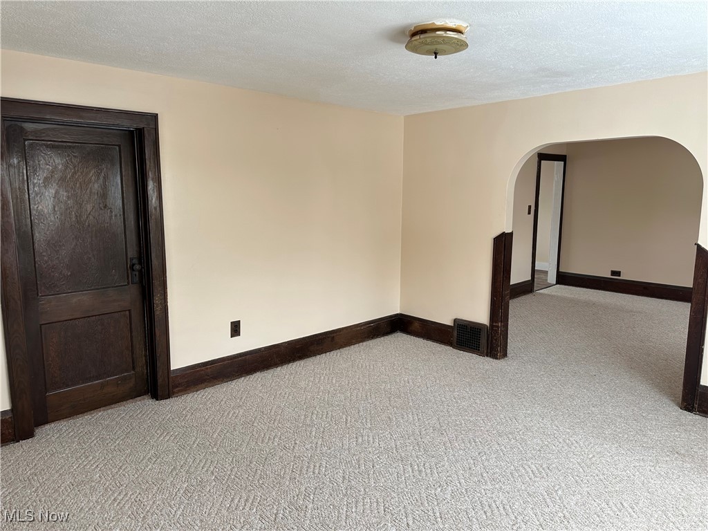 60 Taylor Road Barberton, OH 44203 - Photo 12 of 35 Living room featuring a textured ceiling