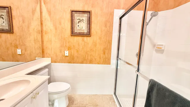 a bathroom with a sink a toilet and tub