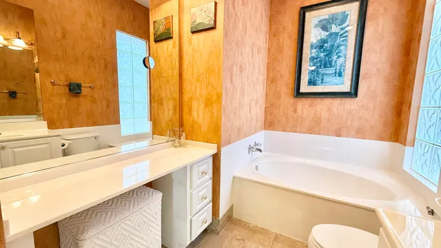 a view of a balcony with dining area and furniture