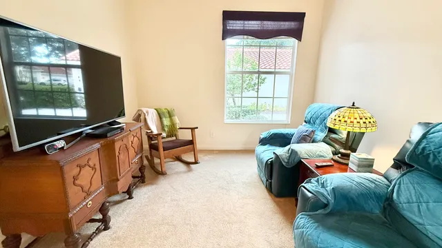 a view of a swimming pool with a patio