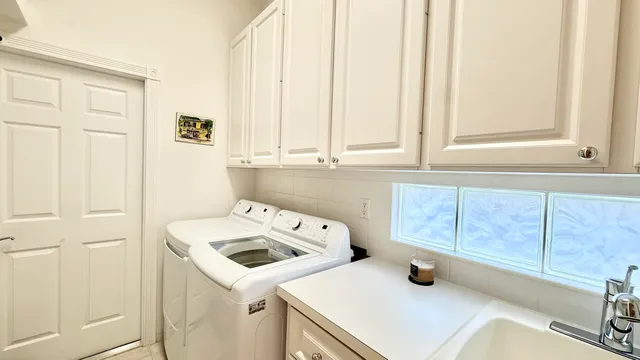 a view of a patio with a table and chairs