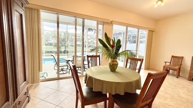 a bedroom with a bed a lamp and a table