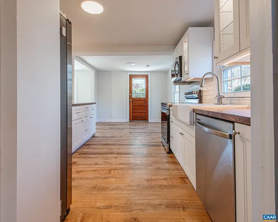 a view of a kitchen from the hallway