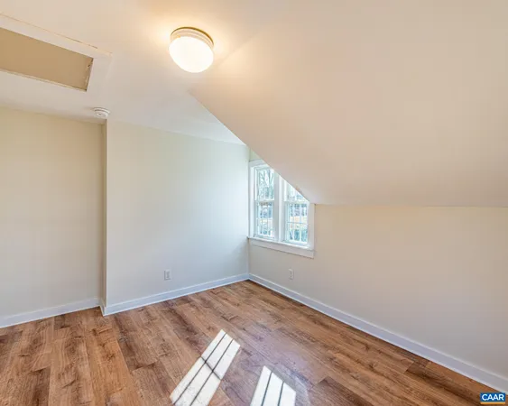 a view of a room that has a window in it