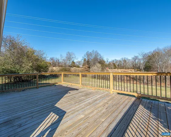 a view of deck with wooden floor and lake view
