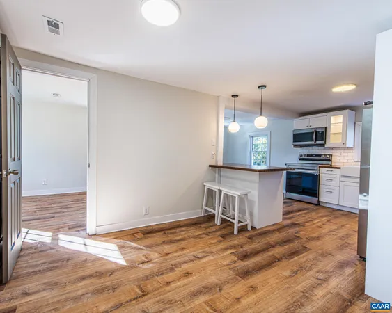 a view of kitchen and wooden floor