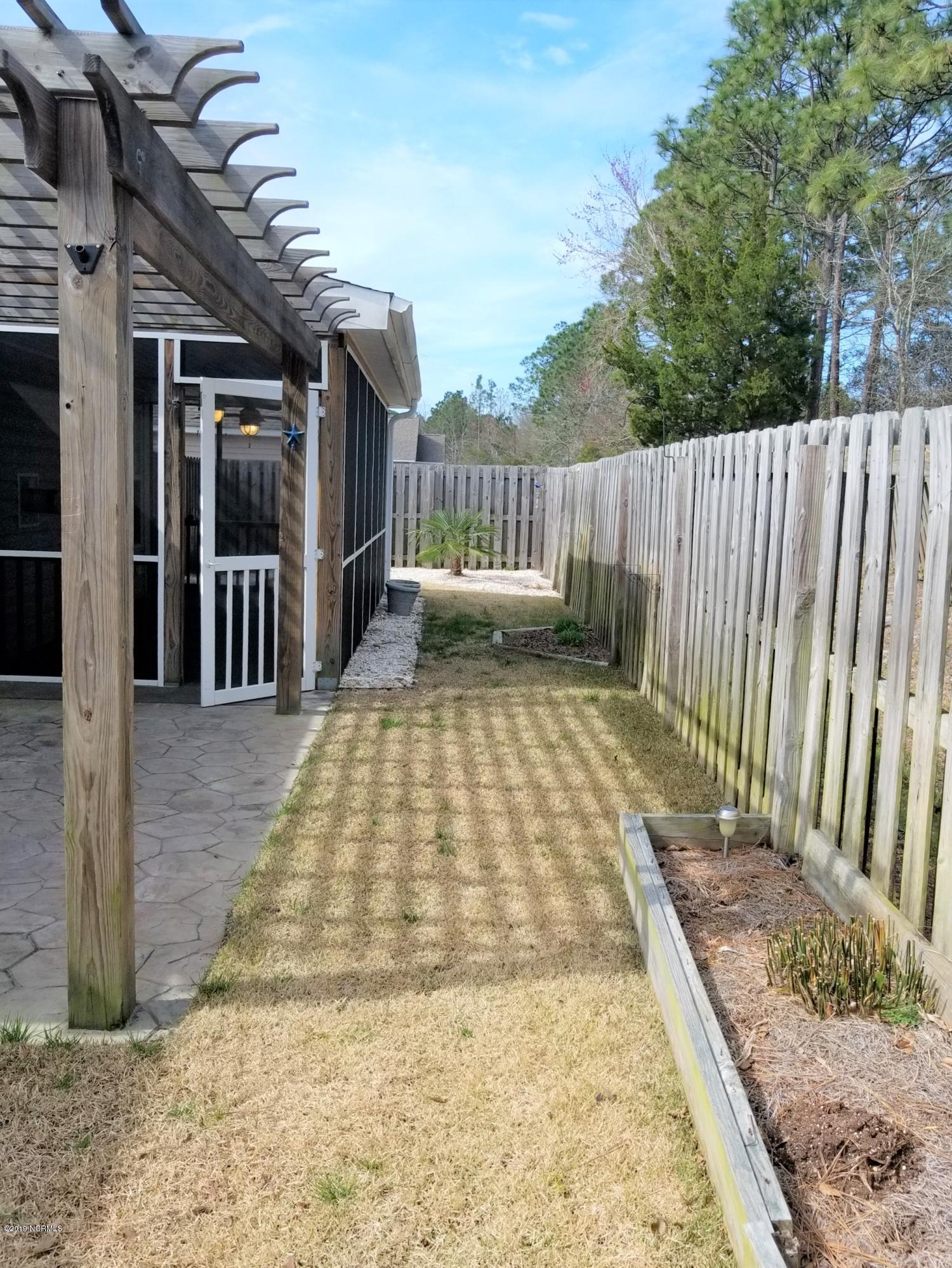 4388 Frying Pan Road Southeast Southport, NC 28461 - Photo 31 of 38 Fenced Yard With Irrigation
