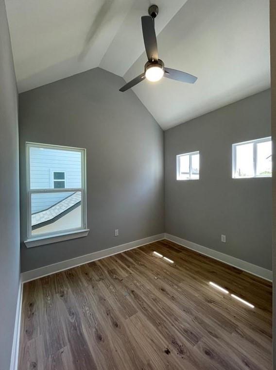 6014 Fairway Street, Unit 2 Austin, TX 78741 - Photo 13 of 20 Spare room with a ceiling fan, vaulted ceiling, and wood finished floors