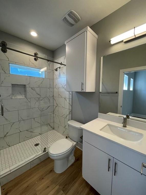 6014 Fairway Street, Unit 2 Austin, TX 78741 - Photo 14 of 20 Full bath with vanity, wood finished floors, and a stall shower