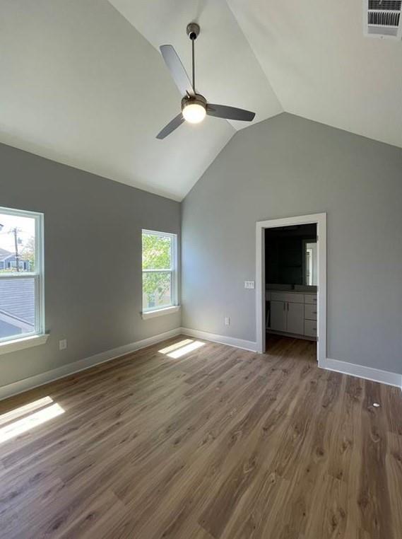 6014 Fairway Street, Unit 2 Austin, TX 78741 - Photo 15 of 20 Unfurnished bedroom with lofted ceiling, wood finished floors, and a ceiling fan