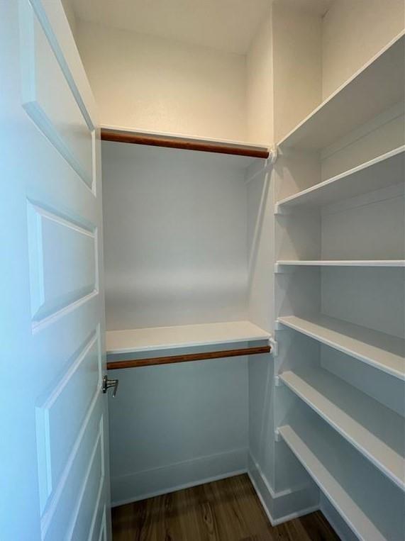 6014 Fairway Street, Unit 2 Austin, TX 78741 - Photo 16 of 20 Walk in closet featuring dark wood-type flooring