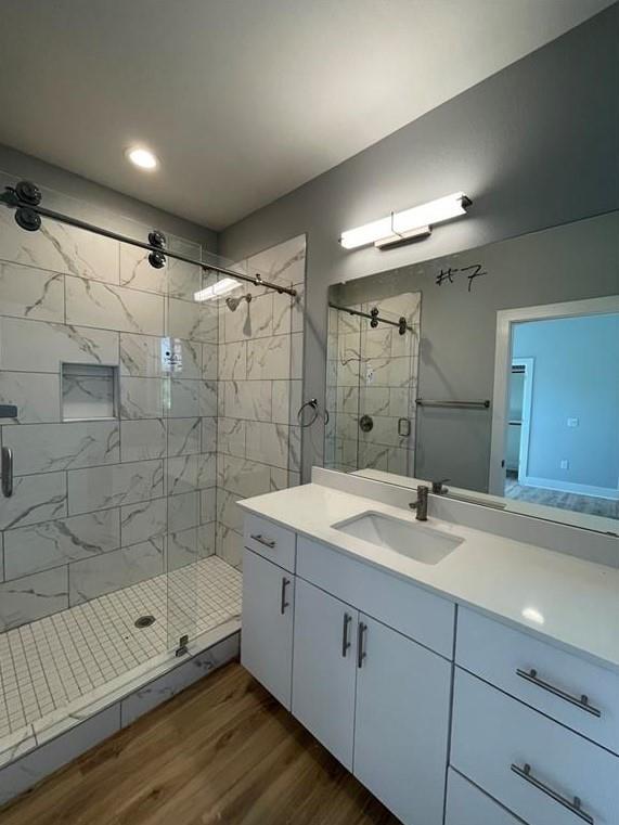 6014 Fairway Street, Unit 2 Austin, TX 78741 - Photo 17 of 20 Full bath featuring wood finished floors, a shower stall, vanity, and recessed lighting