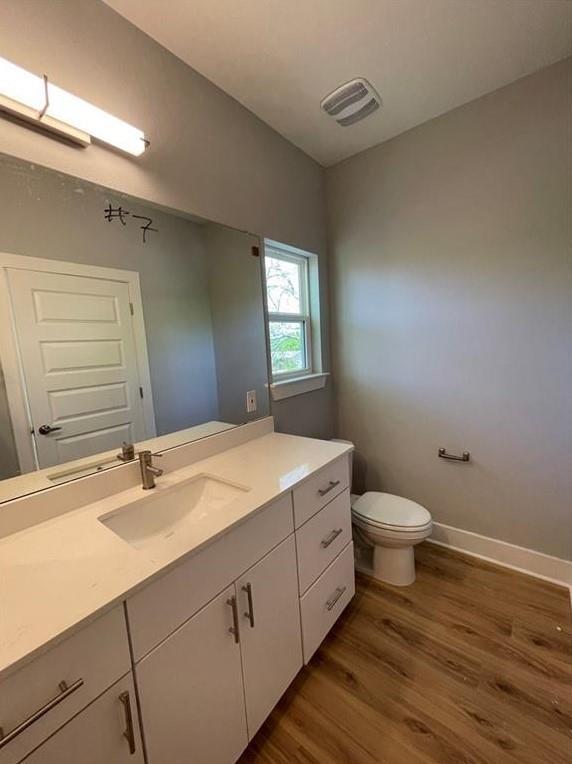 6014 Fairway Street, Unit 2 Austin, TX 78741 - Photo 18 of 20 Bathroom featuring wood finished floors and vanity