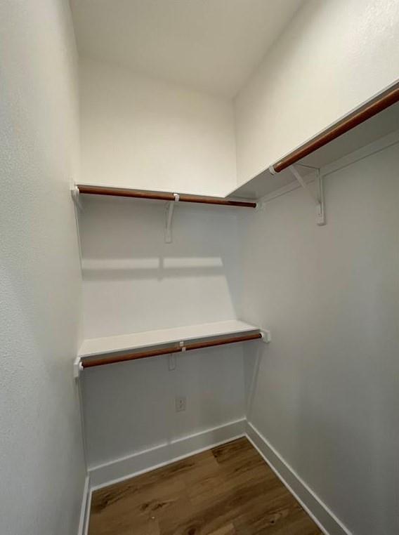 6014 Fairway Street, Unit 2 Austin, TX 78741 - Photo 7 of 20 Walk in closet with dark wood-type flooring