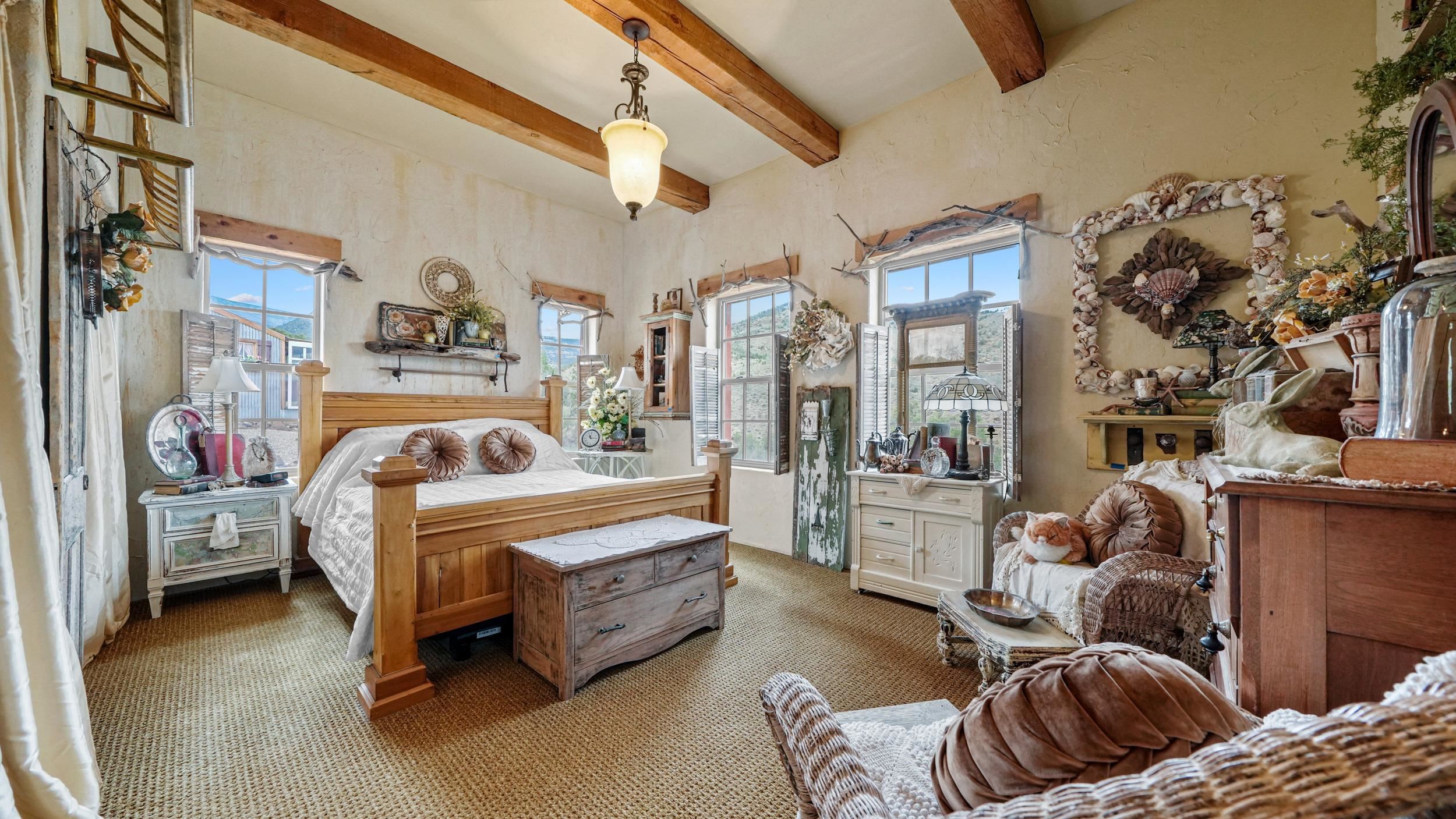 3989 Rapid Creek Road Palisade, CO 81526 - Photo 15 of 39 a bedroom with furniture and a couch