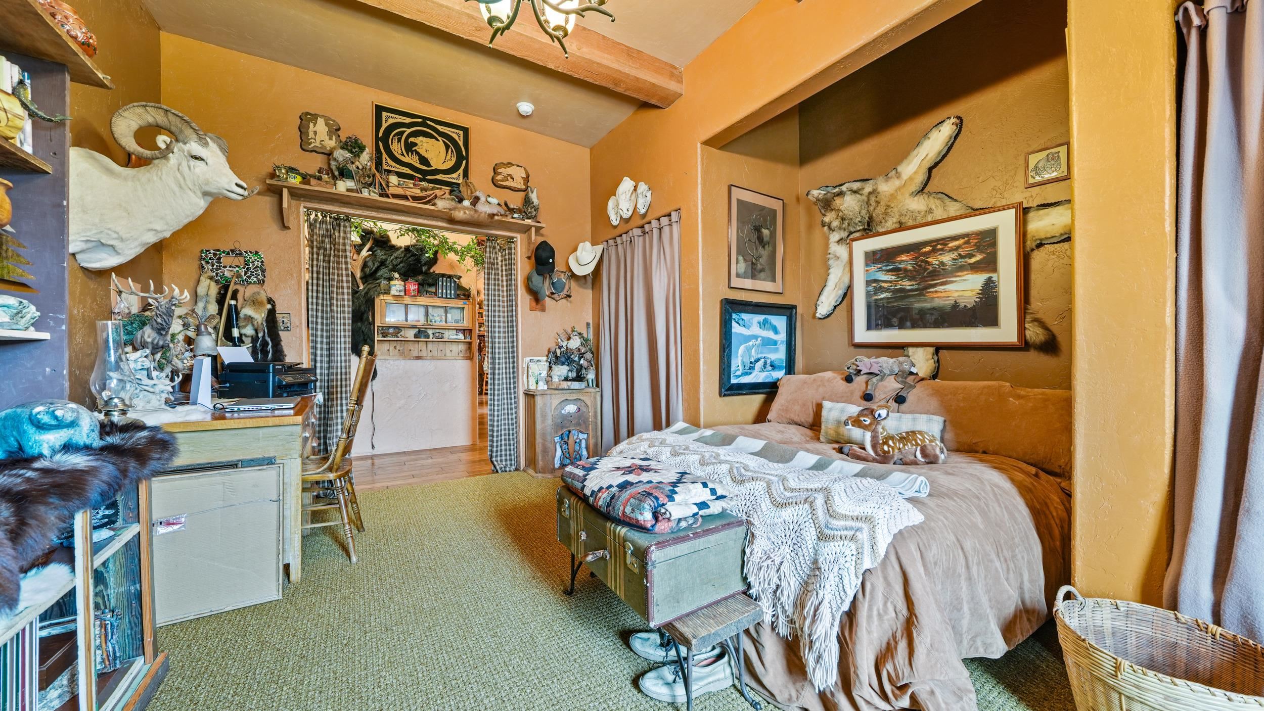 3989 Rapid Creek Road Palisade, CO 81526 - Photo 16 of 39 a bedroom with a bed and a table in it