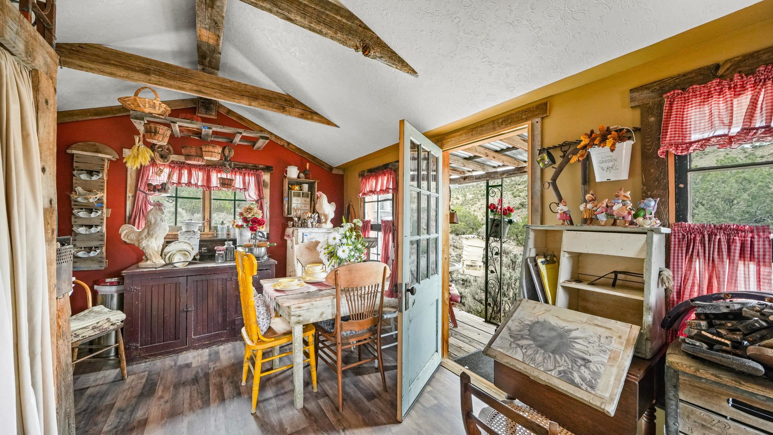3989 Rapid Creek Road Palisade, CO 81526 - Photo 26 of 39 a view of an chairs and dining room with wooden floor