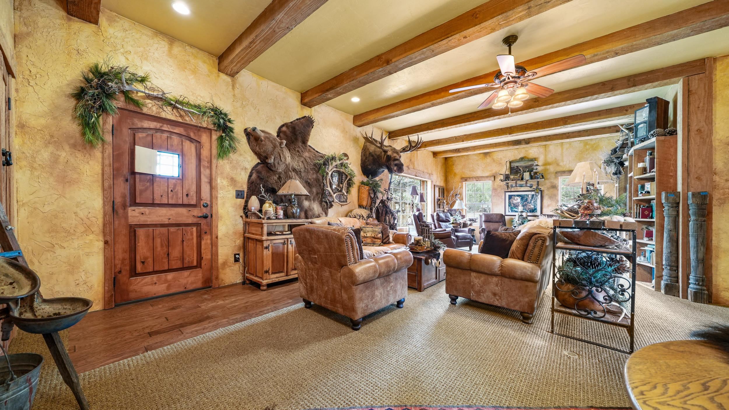 3989 Rapid Creek Road Palisade, CO 81526 - Photo 6 of 39 a living room with furniture and a chandelier