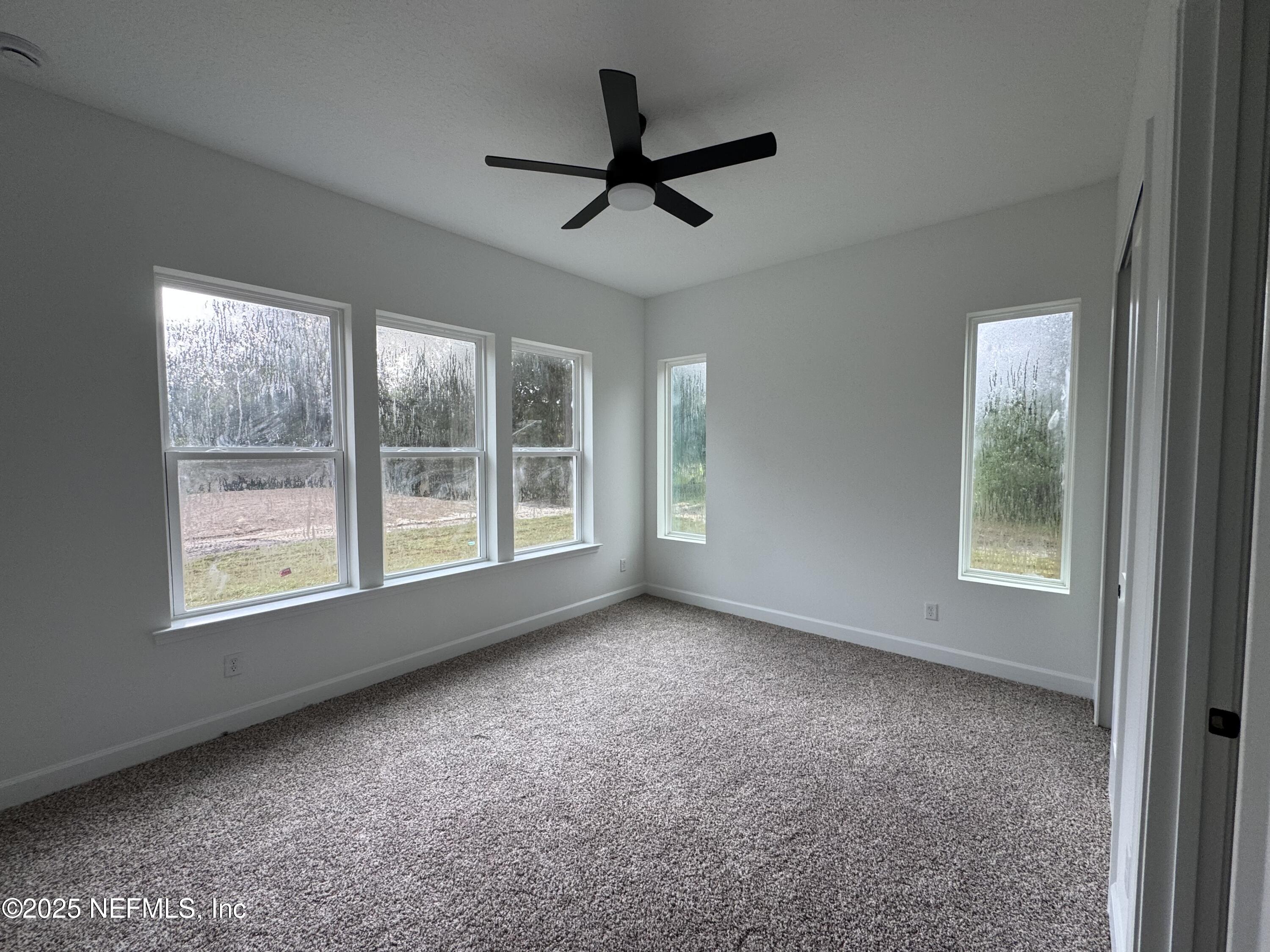 14167 Saddle Ridge Road Macclenny, FL 32063 - Photo 13 of 20 a view of a livingroom with a ceiling fan and window