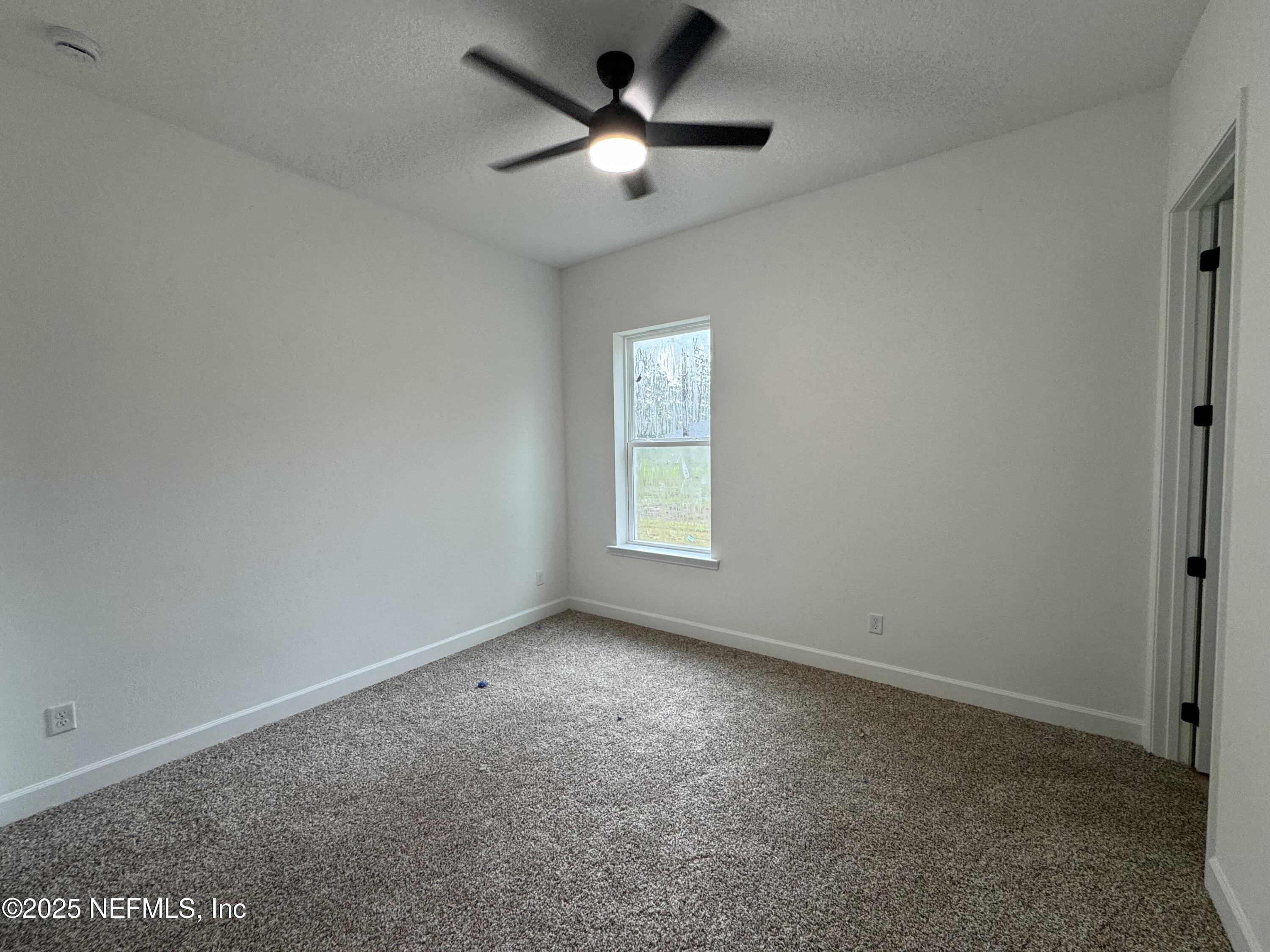 14167 Saddle Ridge Road Macclenny, FL 32063 - Photo 16 of 20 a view of a room with windows and ceiling fan