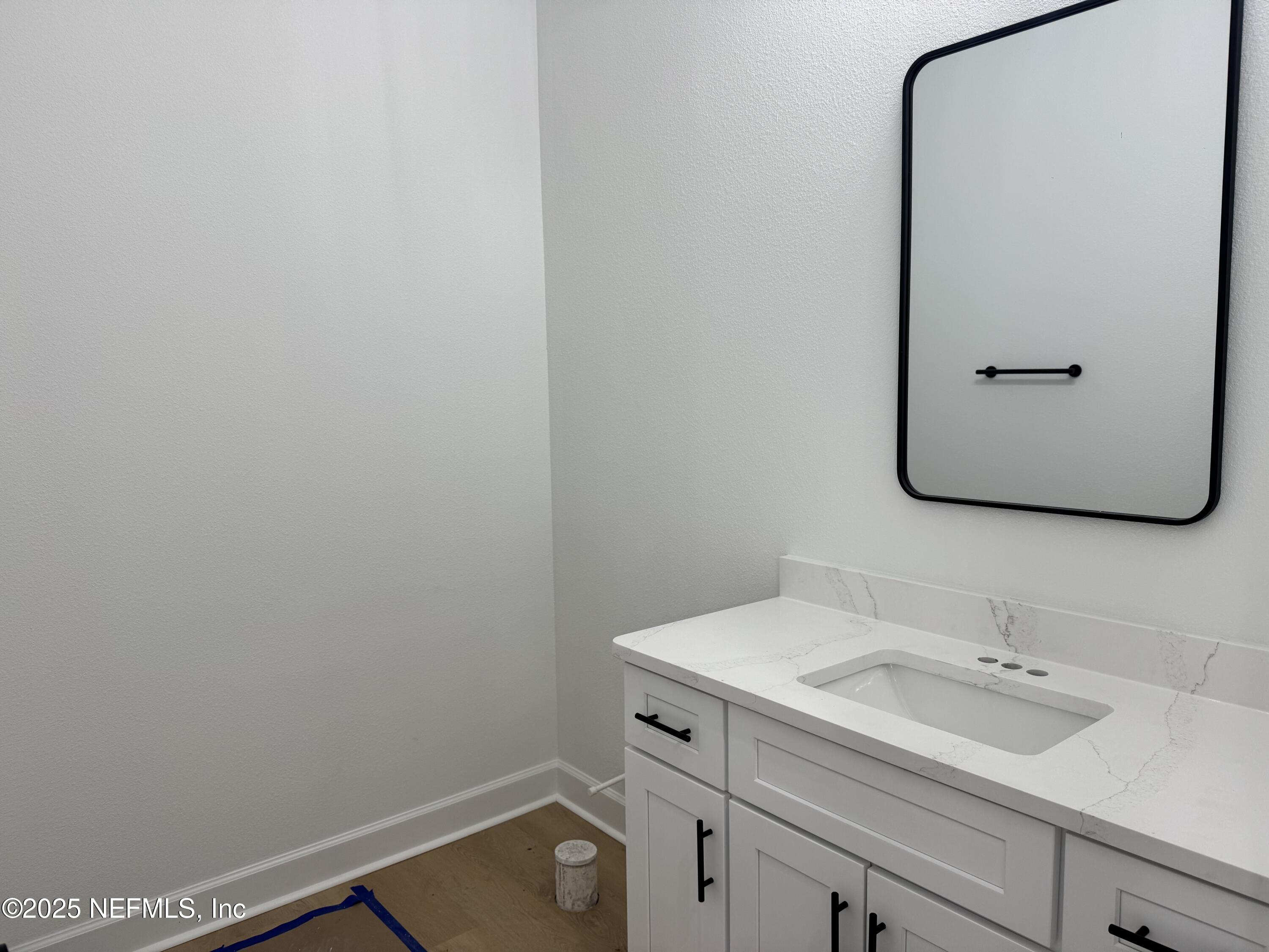14167 Saddle Ridge Road Macclenny, FL 32063 - Photo 8 of 20 a bathroom with a sink and mirror