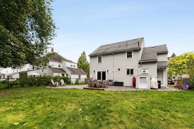 a view of a house with backyard and porch
