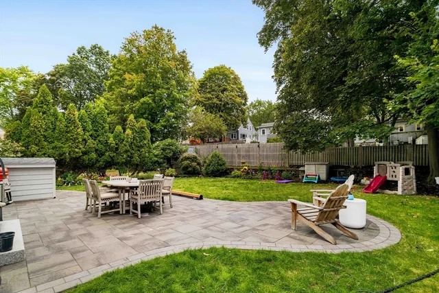a view of a backyard with sitting area