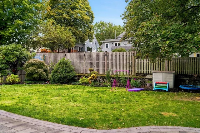 a view of back yard with green space and deck