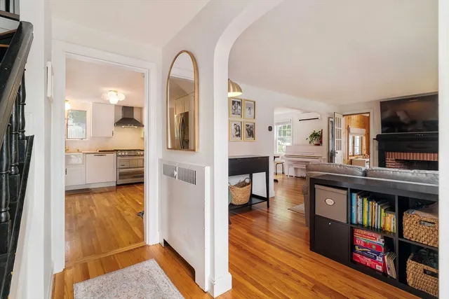 a view of living room kitchen and flat screen tv