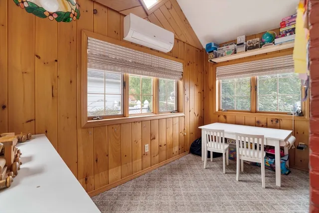 a spacious bedroom with a bed and a window