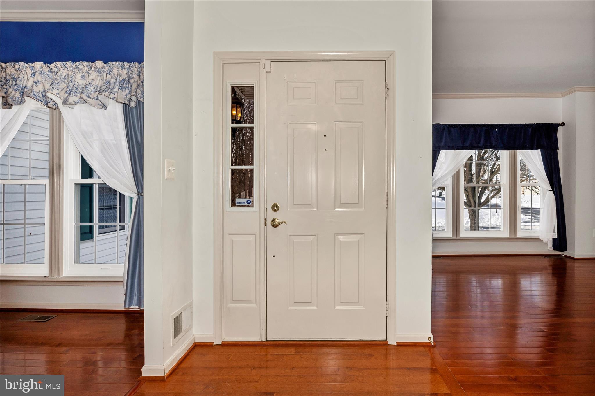 828 Geronimo Drive Frederick, MD 21701 - Photo 16 of 64 a view of a bedroom with wooden floor and windows