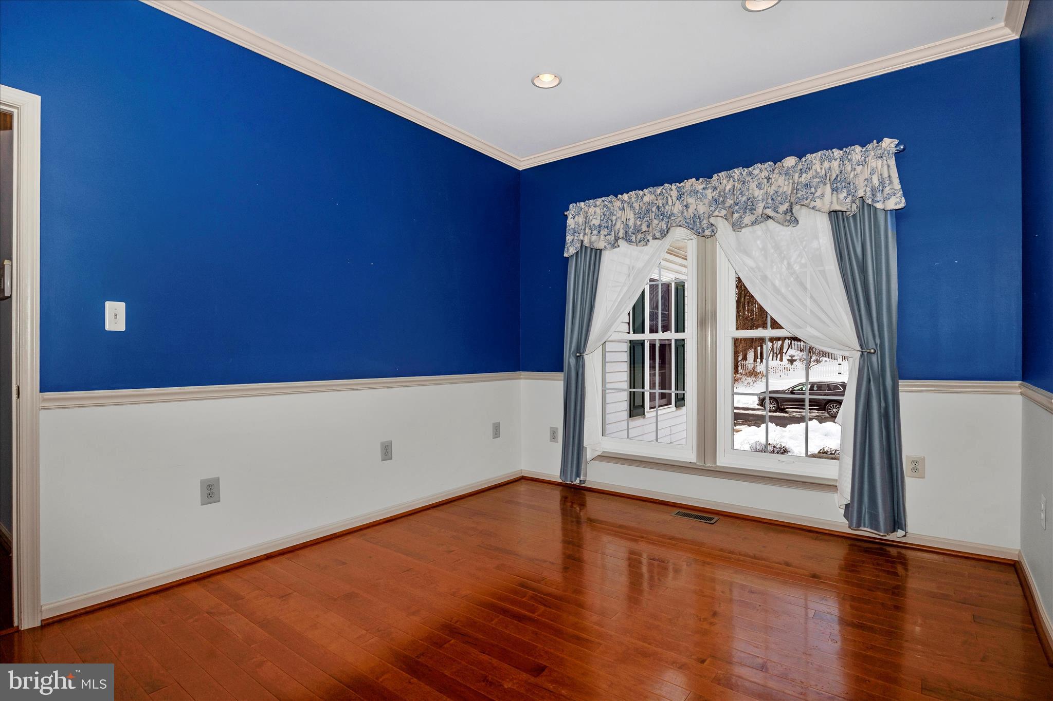 828 Geronimo Drive Frederick, MD 21701 - Photo 19 of 64 an empty room with wooden floor and windows